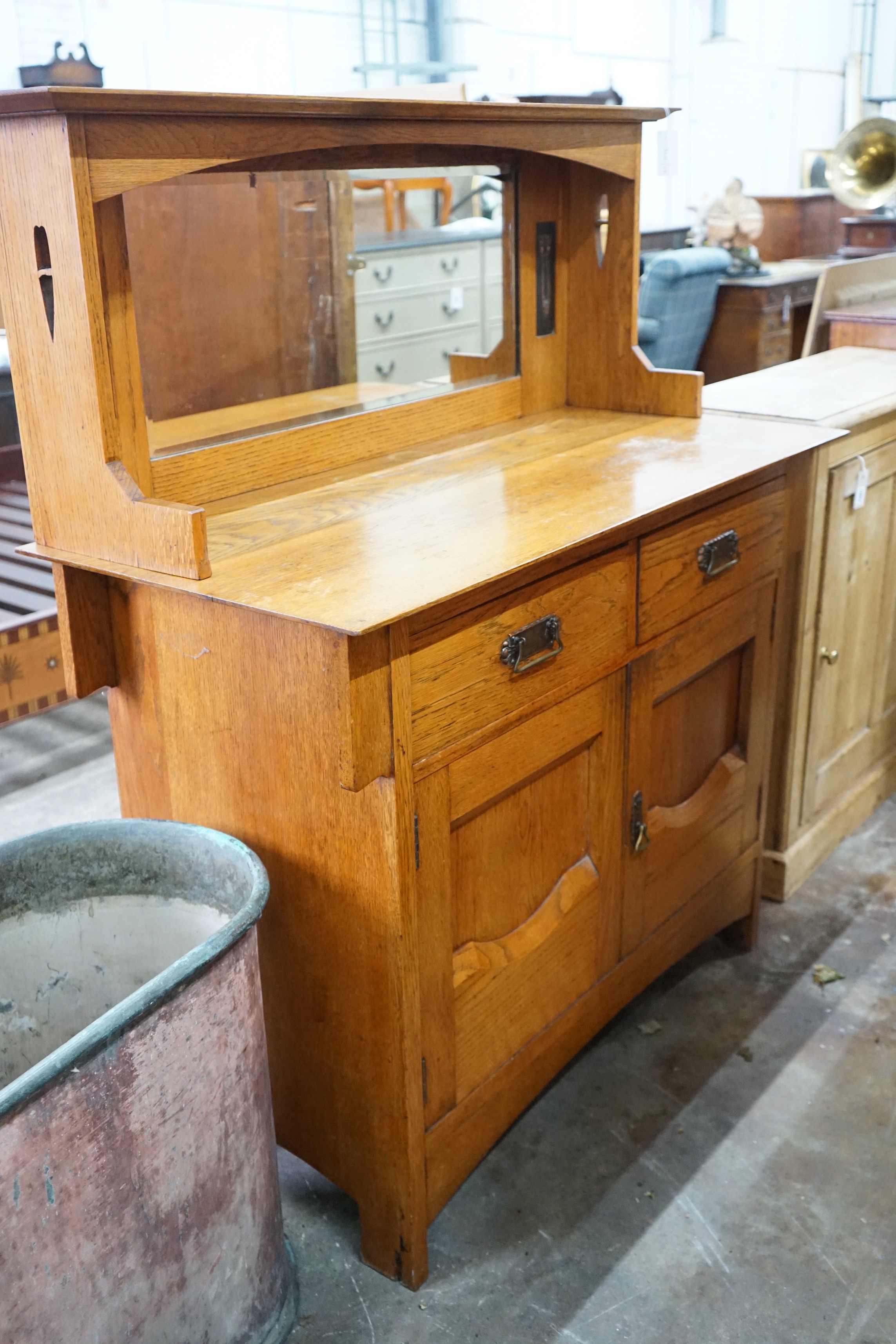 An Art Nouveau oak mirror back sideboard, length 122cm, depth 55cm, height 145cm